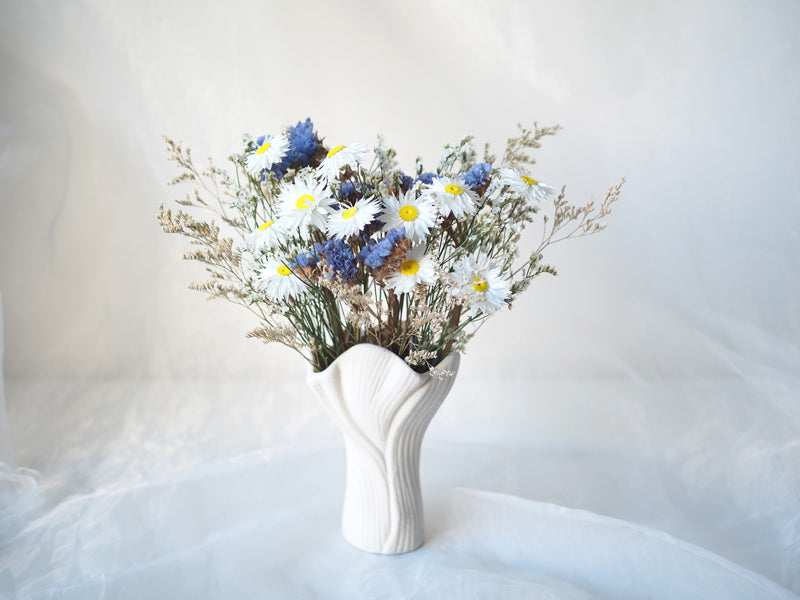 IRIS – white, blue and purple dried flowers in a white ceramic vase