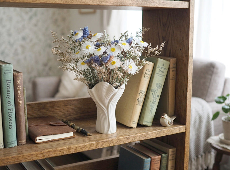 IRIS – white, blue and purple dried flowers in a white ceramic vase
